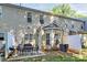 View of the cozy patio with seating and grill in the backyard of this townhouse at 5943 Pisgah Way, Charlotte, NC 28217