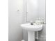 Elegant half bathroom with white pedestal sink, decorative mirror, and modern fixtures at 5943 Pisgah Way, Charlotte, NC 28217