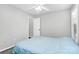 This bedroom has natural light, a ceiling fan, and a walk-in closet at 5943 Pisgah Way, Charlotte, NC 28217