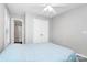 This bedroom has natural light, a ceiling fan, and closet at 5943 Pisgah Way, Charlotte, NC 28217