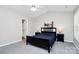 Clean bedroom features neutral tones and vaulted ceilings that give it an airy feel at 5943 Pisgah Way, Charlotte, NC 28217