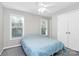 This bedroom has natural light, a ceiling fan, and closet at 5943 Pisgah Way, Charlotte, NC 28217