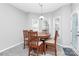 Inviting breakfast nook features a round table and natural light from surrounding windows at 5943 Pisgah Way, Charlotte, NC 28217