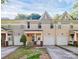 Inviting two-story townhouse with attached garage and well-maintained front yard at 5943 Pisgah Way, Charlotte, NC 28217
