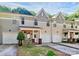 Charming exterior view of the townhouses showing front porches and well-manicured lawns at 5943 Pisgah Way, Charlotte, NC 28217