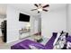 Relaxing living room with a purple couch, stylish coffee table, and wall-mounted television at 5943 Pisgah Way, Charlotte, NC 28217