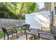Cozy patio area with outdoor seating and a grill, perfect for relaxation and entertaining at 5943 Pisgah Way, Charlotte, NC 28217