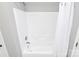 Bright bathroom featuring a shower with white tile surround and modern fixtures at 5943 Pisgah Way, Charlotte, NC 28217