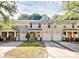 Inviting townhouse exteriors with attached garages, front porches, and well-maintained landscaping at 5943 Pisgah Way, Charlotte, NC 28217