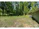 Exterior of home with new siding, updated roof, and private, wooded backyard for relaxing at 611 Fernwood Dr, Albemarle, NC 28001