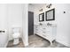 Bathroom featuring double vanity, modern fixtures, and hard surface flooring at 611 Fernwood Dr, Albemarle, NC 28001