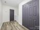 Functional hallway with laundry area featuring washer/dryer and large closet space at 611 Fernwood Dr, Albemarle, NC 28001