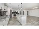 Bright kitchen with an island, stainless steel appliances, and an open floor plan at 611 Fernwood Dr, Albemarle, NC 28001
