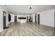 Bright, open living area showcasing modern flooring and a seamless kitchen connection at 611 Fernwood Dr, Albemarle, NC 28001