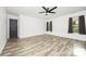 Bright main bedroom with large windows and a ceiling fan at 611 Fernwood Dr, Albemarle, NC 28001