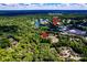A bird's eye view highlights Quail Hollow Club near a desirable residential area at 6516 Sharon Hills Rd, Charlotte, NC 28210