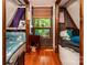 Compact bedroom with slanted walls, a window seat, and twin beds for maximum space-saving at 6516 Sharon Hills Rd, Charlotte, NC 28210