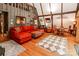 Open concept living area in A-frame, wood walls, high ceilings, and loft at 6516 Sharon Hills Rd, Charlotte, NC 28210