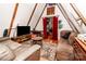 Cozy living room with A-frame ceiling, hardwood floors, and comfortable seating area at 6516 Sharon Hills Rd, Charlotte, NC 28210