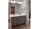 Bathroom featuring a double vanity, a large mirror, and stylish decor at 704 Robert Moses Dr # 121, Gastonia, NC 28056