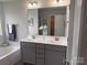 Bright bathroom featuring a double vanity, a soaking tub and a walk-in shower at 704 Robert Moses Dr # 121, Gastonia, NC 28056
