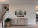 Welcoming entryway featuring a stylish cabinet, modern decor, and access to the staircase at 704 Robert Moses Dr # 121, Gastonia, NC 28056
