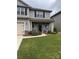 Charming two-story home with a two car garage, beautifully landscaped yard, and gray siding at 704 Robert Moses Dr # 121, Gastonia, NC 28056