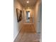 Hallway with neutral carpeting, light walls, and access to multiple rooms at 704 Robert Moses Dr # 121, Gastonia, NC 28056