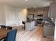 Bright kitchen features stainless steel appliances, an island, and wood-look flooring at 704 Robert Moses Dr # 121, Gastonia, NC 28056