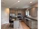Modern kitchen with stainless steel appliances, granite countertops, an island and gray cabinets at 704 Robert Moses Dr # 121, Gastonia, NC 28056
