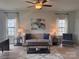 Cozy living room with neutral colored sofa, modern decor, and plenty of natural light at 704 Robert Moses Dr # 121, Gastonia, NC 28056