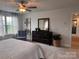 Main bedroom featuring a ceiling fan, a window, and dark wood furniture at 704 Robert Moses Dr # 121, Gastonia, NC 28056
