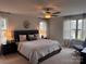 Spacious main bedroom with a ceiling fan, and large windows for natural light at 704 Robert Moses Dr # 121, Gastonia, NC 28056