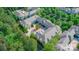 An aerial view of a multi-unit complex with mature landscaping and ample parking, offering a serene living environment at 9047 Rosalyn Glen Rd, Cornelius, NC 28031