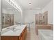 Bright bathroom with double sinks and accessible features at 9047 Rosalyn Glen Rd, Cornelius, NC 28031
