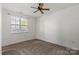 Bedroom with a ceiling fan and neutral carpet at 9047 Rosalyn Glen Rd, Cornelius, NC 28031