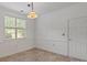 Bright dining area with tiled floor, window, and door access, creating a versatile and functional space at 9047 Rosalyn Glen Rd, Cornelius, NC 28031