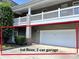 Two-story condo showing a white two-car garage below a matching balcony and partial front entrance at 9047 Rosalyn Glen Rd, Cornelius, NC 28031