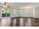 Expansive living space boasting hardwood floors, neutral walls, generous natural light, and flexible layout at 9047 Rosalyn Glen Rd, Cornelius, NC 28031