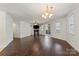 The expansive living area features hardwood floors, neutral walls, and abundant natural light, creating a serene atmosphere at 9047 Rosalyn Glen Rd, Cornelius, NC 28031