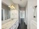 Stylish bathroom with granite countertops, double vanity, and walk-in shower, featuring bright lighting at 907 Ospre Ln, Fort Mill, SC 29708