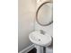 Modern powder room featuring a pedestal sink with a stylish mirror at 907 Ospre Ln, Fort Mill, SC 29708