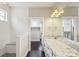Spacious bathroom with white subway tiles, granite countertops, and access to walk-in closet at 907 Ospre Ln, Fort Mill, SC 29708