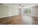 Large bedroom features hardwood floors, a ceiling fan and bright white trim at 907 Ospre Ln, Fort Mill, SC 29708