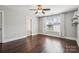 Bright bedroom features hardwood floors, a ceiling fan and bright white trim at 907 Ospre Ln, Fort Mill, SC 29708