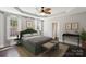 Tranquil bedroom with tray ceilings, neutral walls, and large windows for natural light at 907 Ospre Ln, Fort Mill, SC 29708