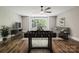 Spacious game room featuring hardwood floors, foosball table and comfortable seating at 907 Ospre Ln, Fort Mill, SC 29708