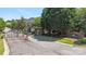 Gated entrance to a community with brick signage surrounded by mature trees and landscaping at 907 Ospre Ln, Fort Mill, SC 29708