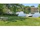 A scenic lake view with a private dock surrounded by lush greenery, creating a peaceful retreat at 907 Ospre Ln, Fort Mill, SC 29708