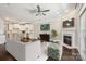 Open-concept living space with hardwood floors, a fireplace, and seamless connection to the kitchen at 907 Ospre Ln, Fort Mill, SC 29708